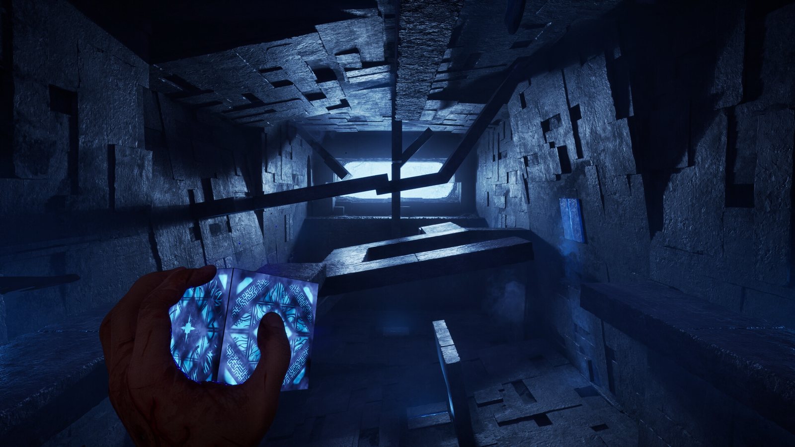 A vast blue-lit stone chamber of floating blocks and beams